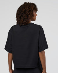 Woman wearing AfterDark ZeroCrease Cropped Tee - Black | Model:Tomi | Size:S | Thumbnail Index: 2