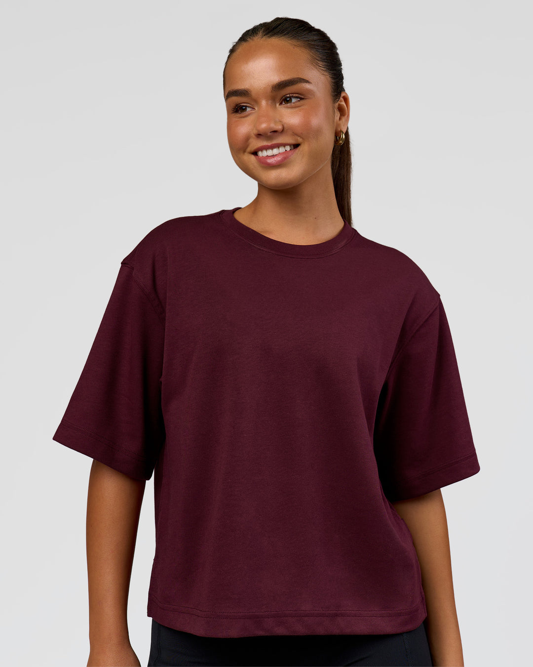 Woman wearing AfterDark ZeroCrease Cropped Tee - Cherry Lacquer | Model:Sophia | Size:S - view 1