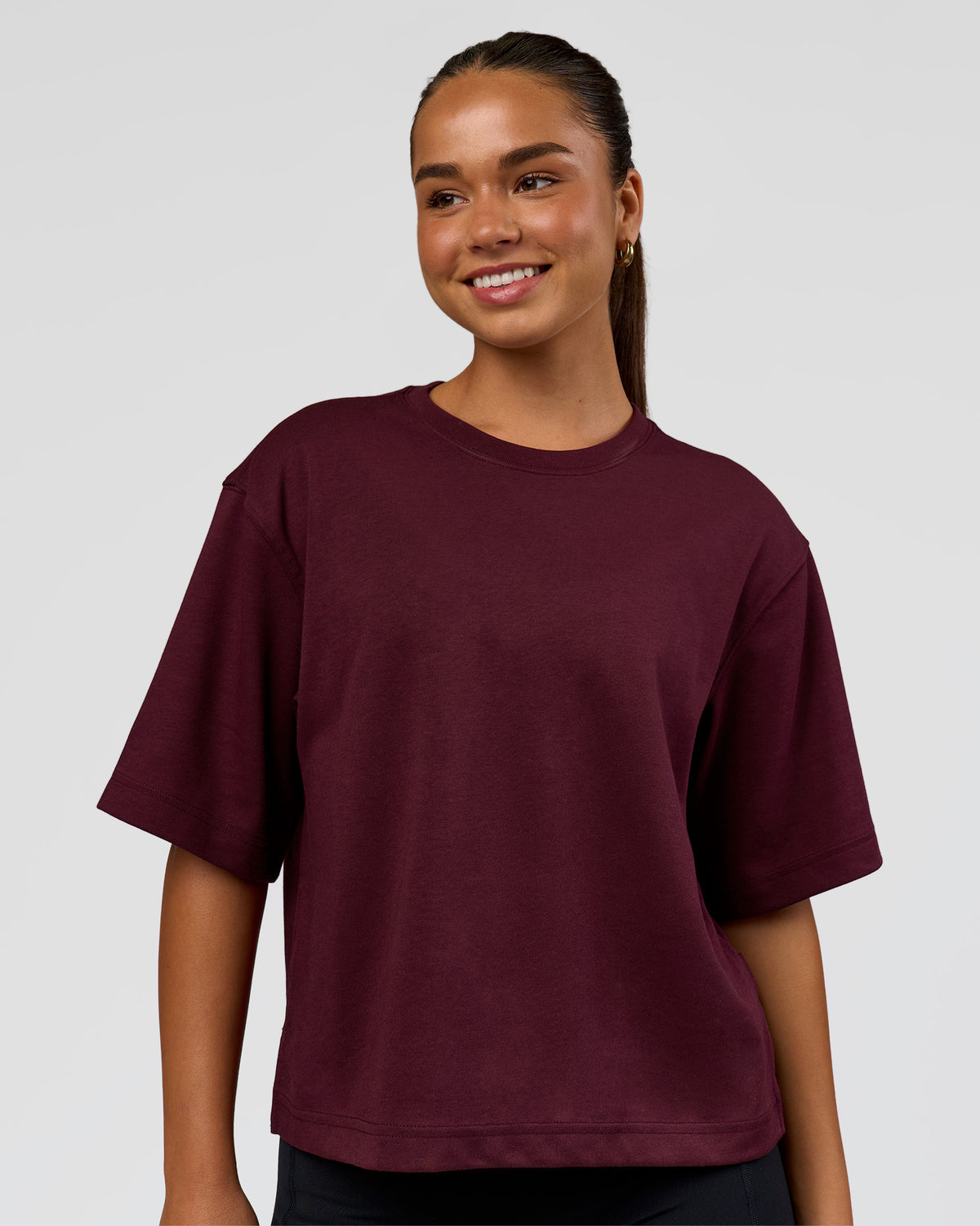 Woman wearing AfterDark ZeroCrease Cropped Tee - Cherry Lacquer | Model:Sophia | Size:S