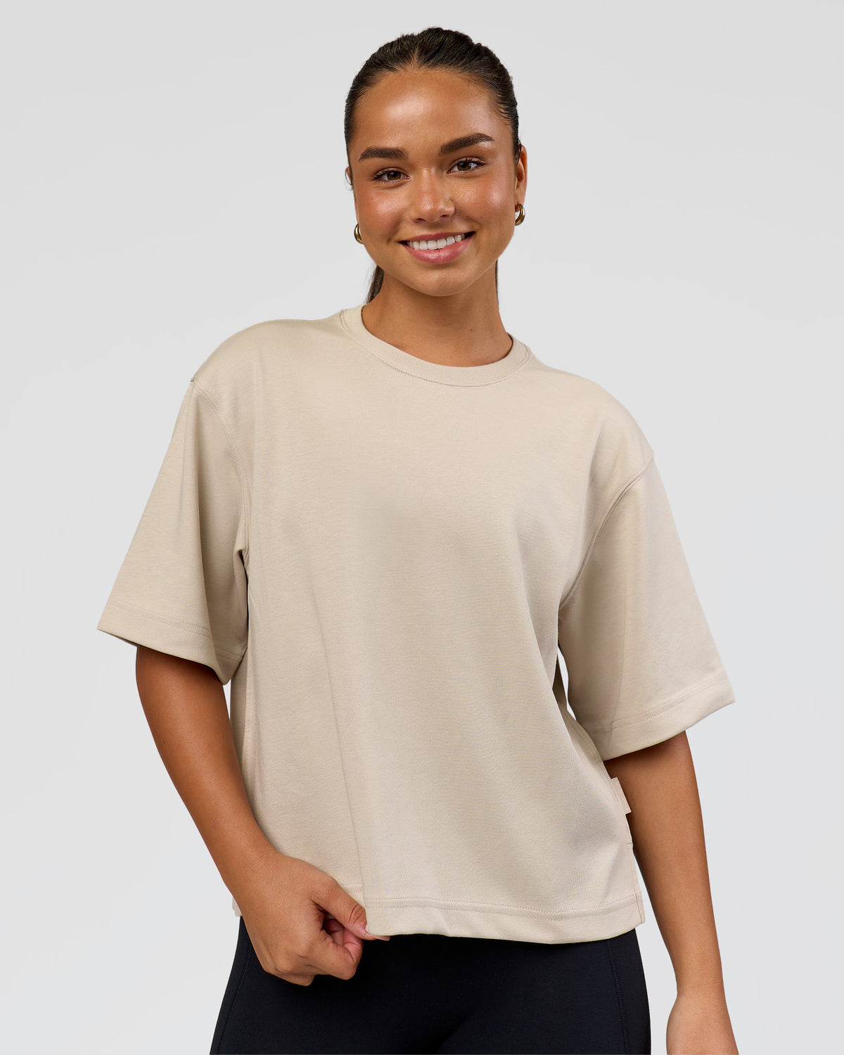 Woman wearing AfterDark ZeroCrease Cropped Tee - Shale Beige | Model:Sophia | Size:S