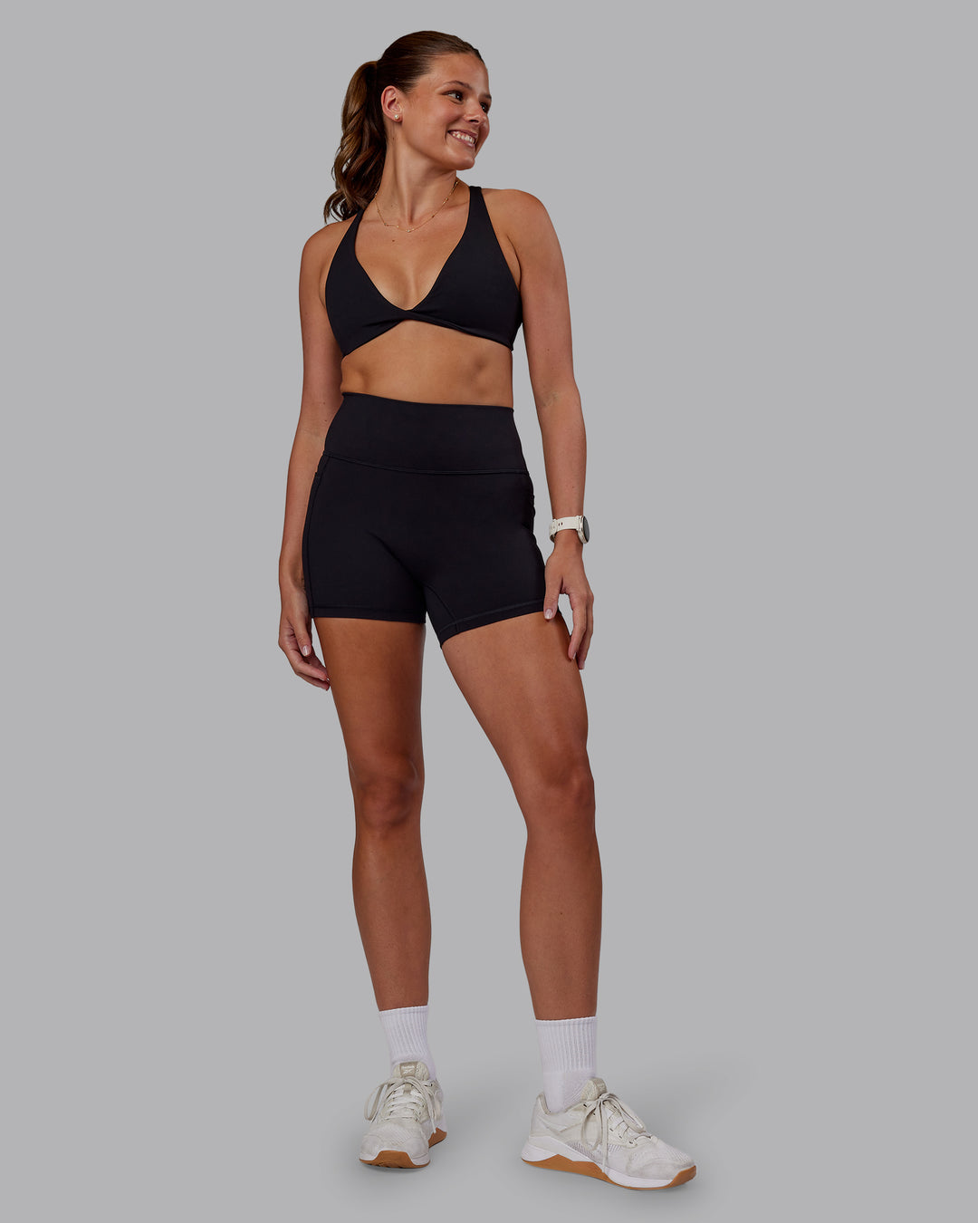 Woman wearing Agile Sports Bra - Black| Model:Phoebe | Size:S - view 5