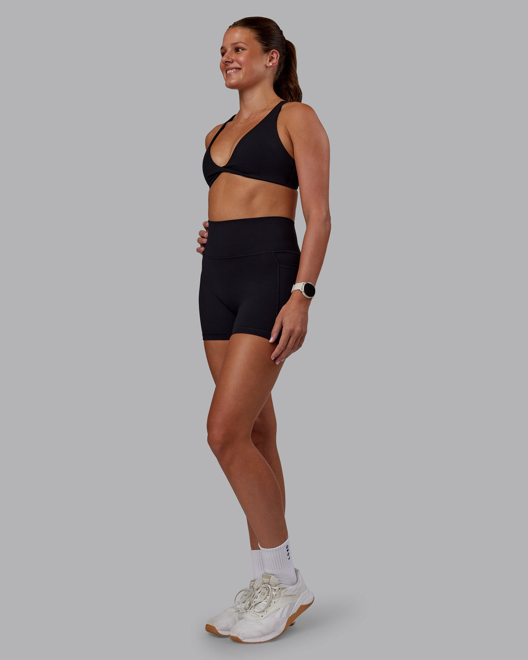 Woman wearing Agile Sports Bra - Black| Model:Phoebe | Size:S - view 3