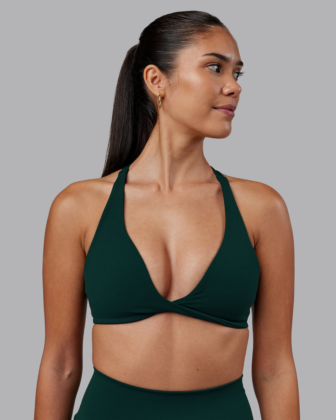 Woman wearing Agile Sports Bra - Dark Moss | Model:Rhiley | Size:S - view 1
