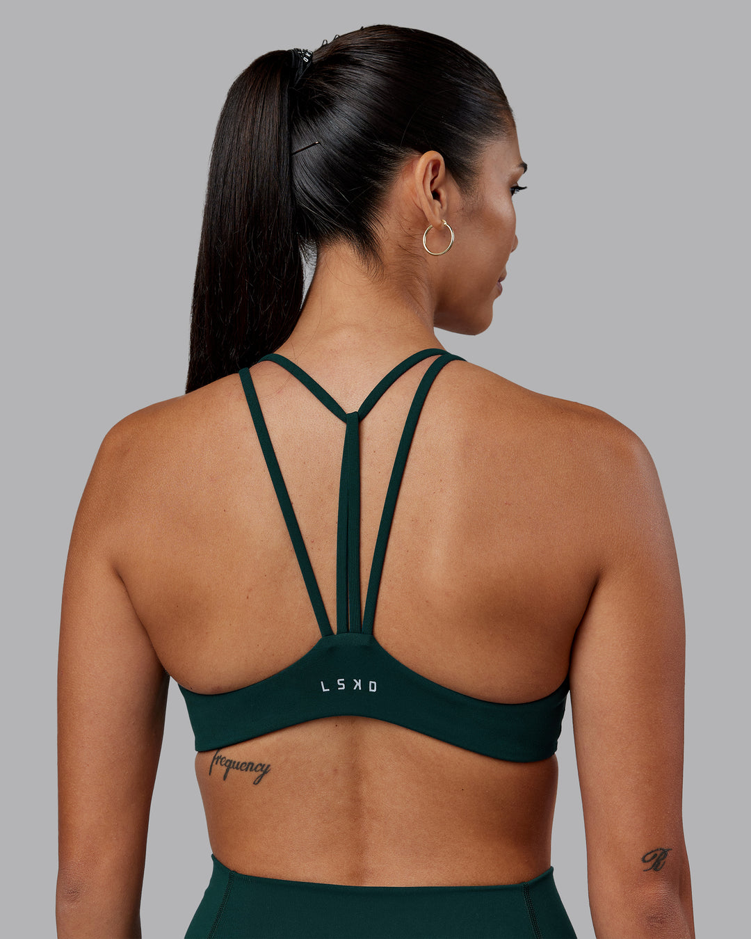 Woman wearing Agile Sports Bra - Dark Moss | Model:Rhiley | Size:S - view 2