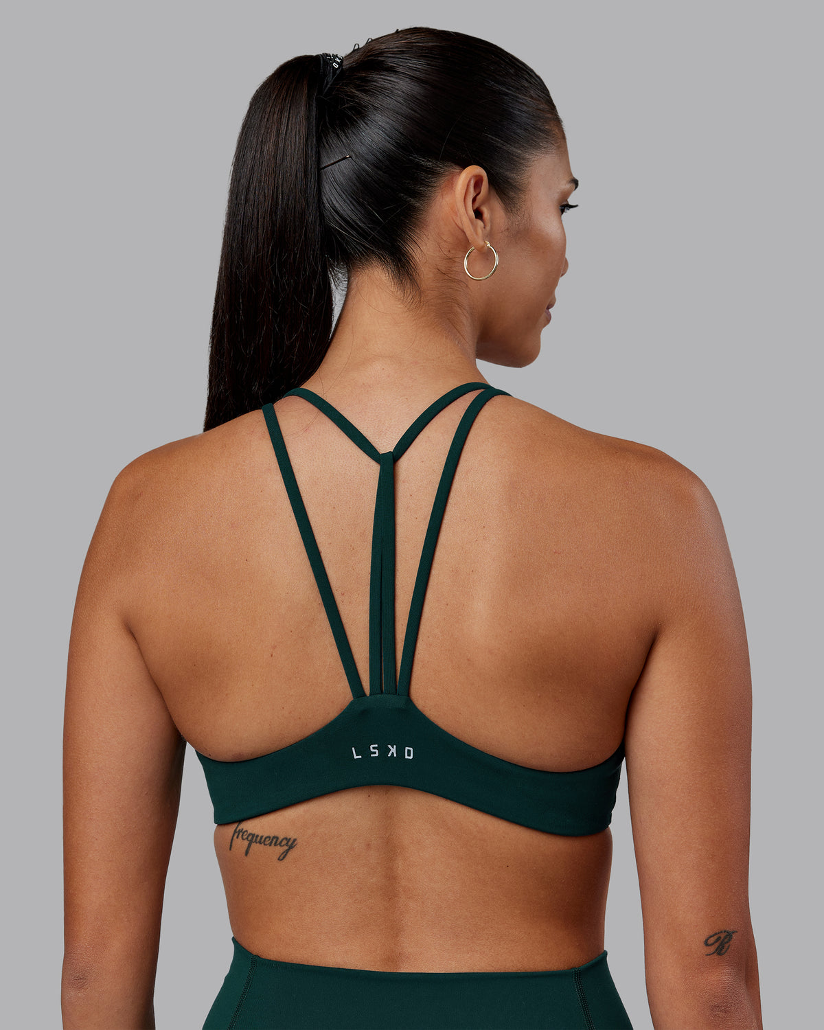 Woman wearing Agile Sports Bra - Dark Moss | Model:Rhiley | Size:S