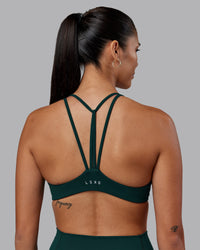 Woman wearing Agile Sports Bra - Dark Moss | Model:Rhiley | Size:S | Thumbnail Index: 1