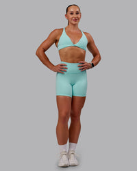 Woman wearing Agile Sports Bra in Island Paradise | Size:S | Thumbnail Index: 6