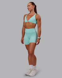 Woman wearing Agile Sports Bra in Island Paradise | Size:S | Thumbnail Index: 4