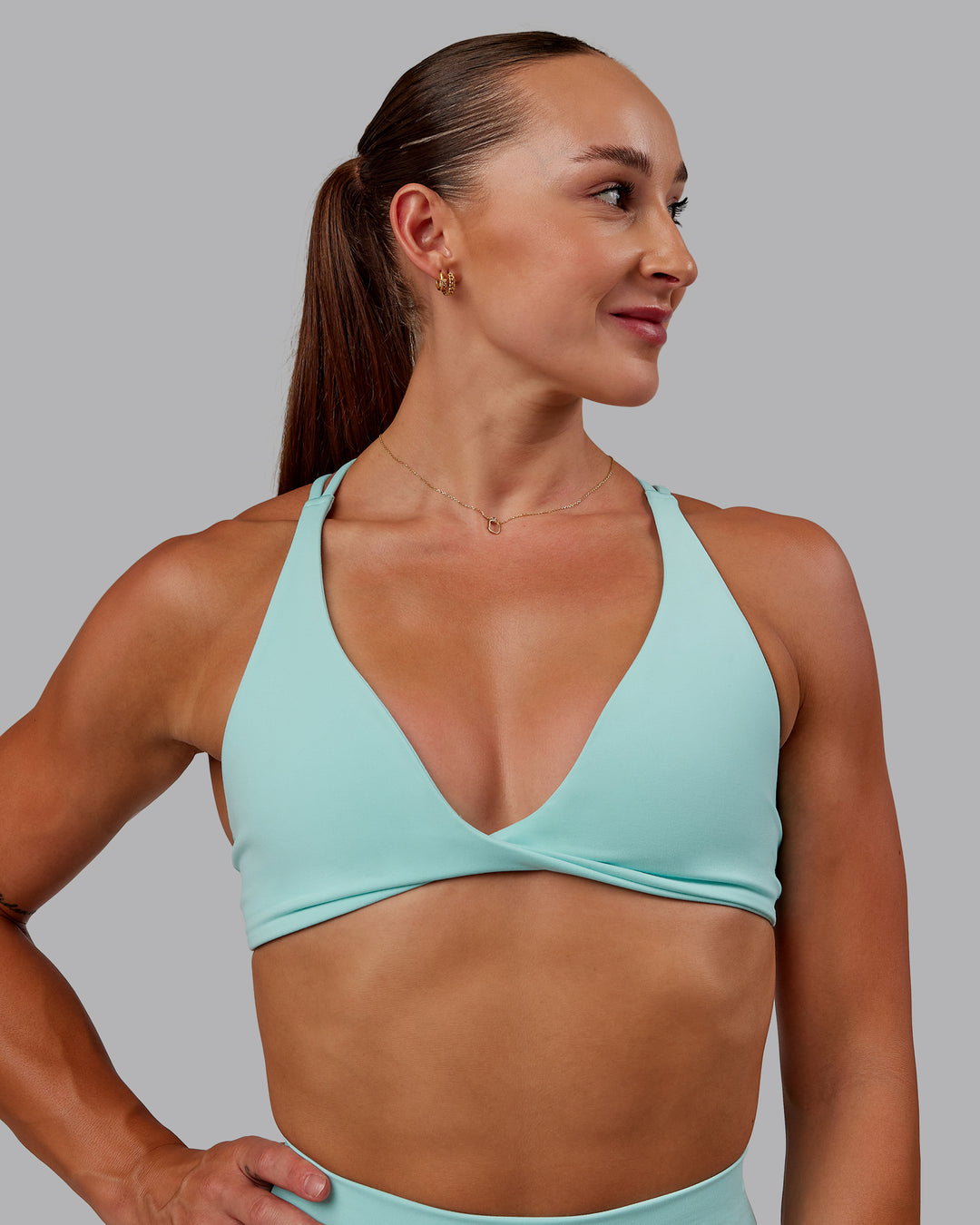 Woman wearing Agile Sports Bra in Island Paradise | Size:S - view 4