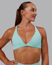 Woman wearing Agile Sports Bra in Island Paradise | Size:S | Thumbnail Index: 3