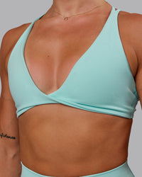 Woman wearing Agile Sports Bra in Island Paradise | Size:S | Thumbnail Index: 5