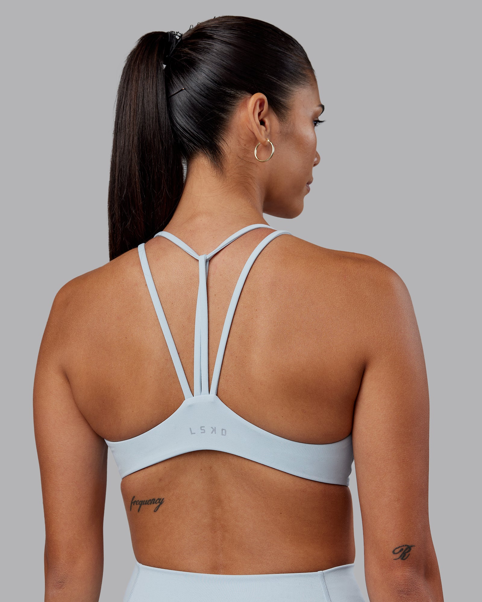 Woman wearing Agile Sports Bra - Skyride | Model:Rhiley | Size:S