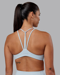 Woman wearing Agile Sports Bra - Skyride | Model:Rhiley | Size:S | Thumbnail Index: 0