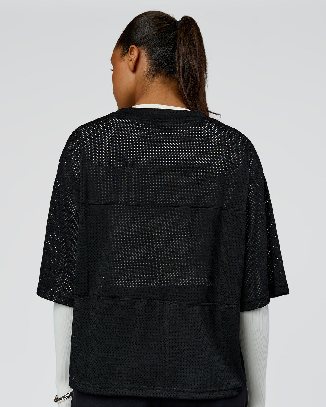 Woman wearing AirCore Jersey - Black-Black | Model:Rosie | Size:S - view 9
