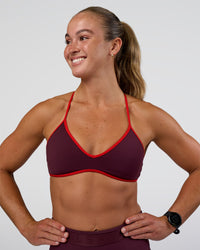 Woman wearing Ambience Sports Bra - Cherry Lacquer-Flame | Model:Sav | Size:S | Thumbnail Index: 3