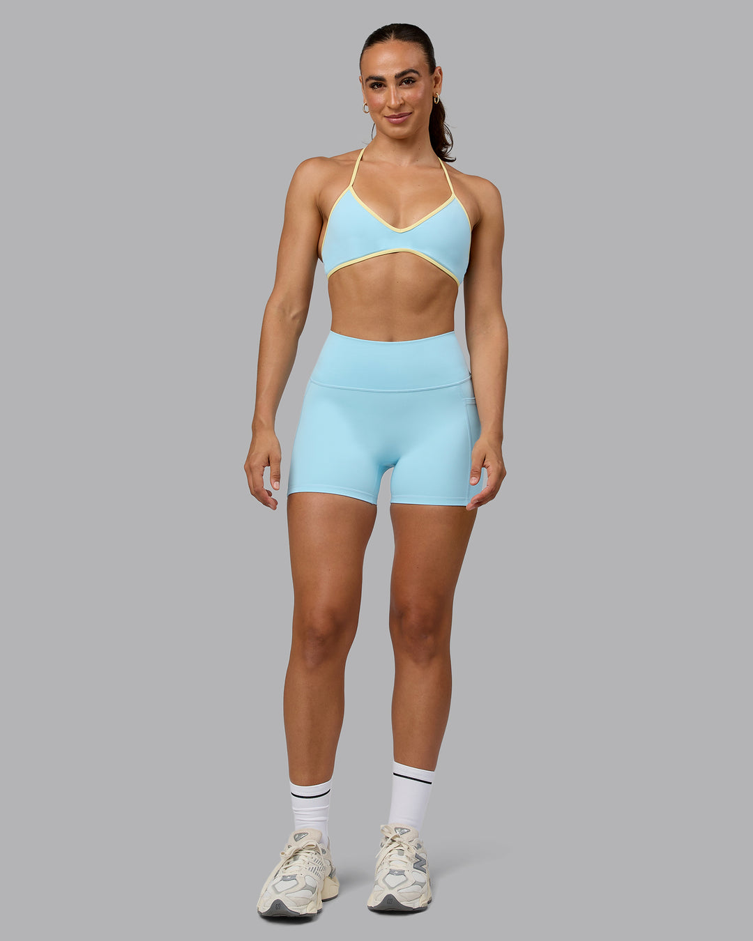 Woman wearing Ambience Sports Bra - Crystal Blue-Lemon - view 5