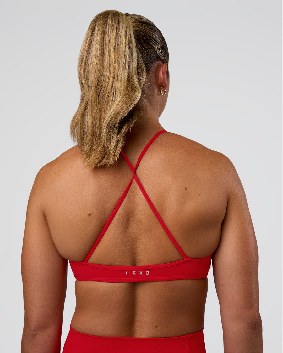 Woman wearing Ambience Sports Bra - Flame | Model:Sav | Size:S - view 2