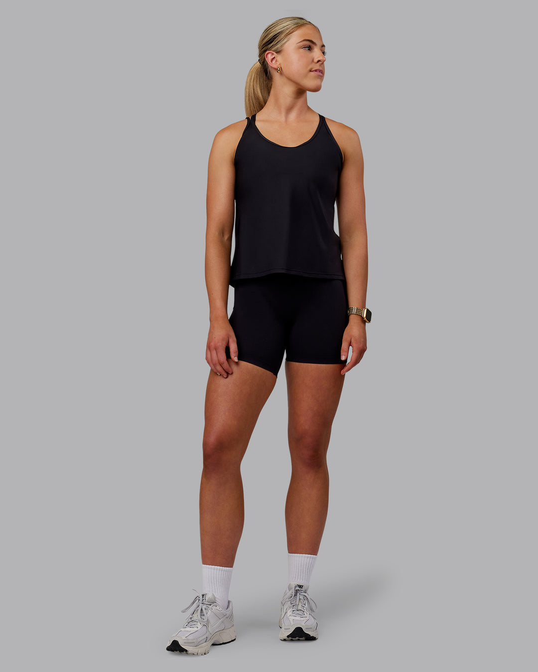 Woman wearing Apex Lightweight Performance Tank - Black - view 5