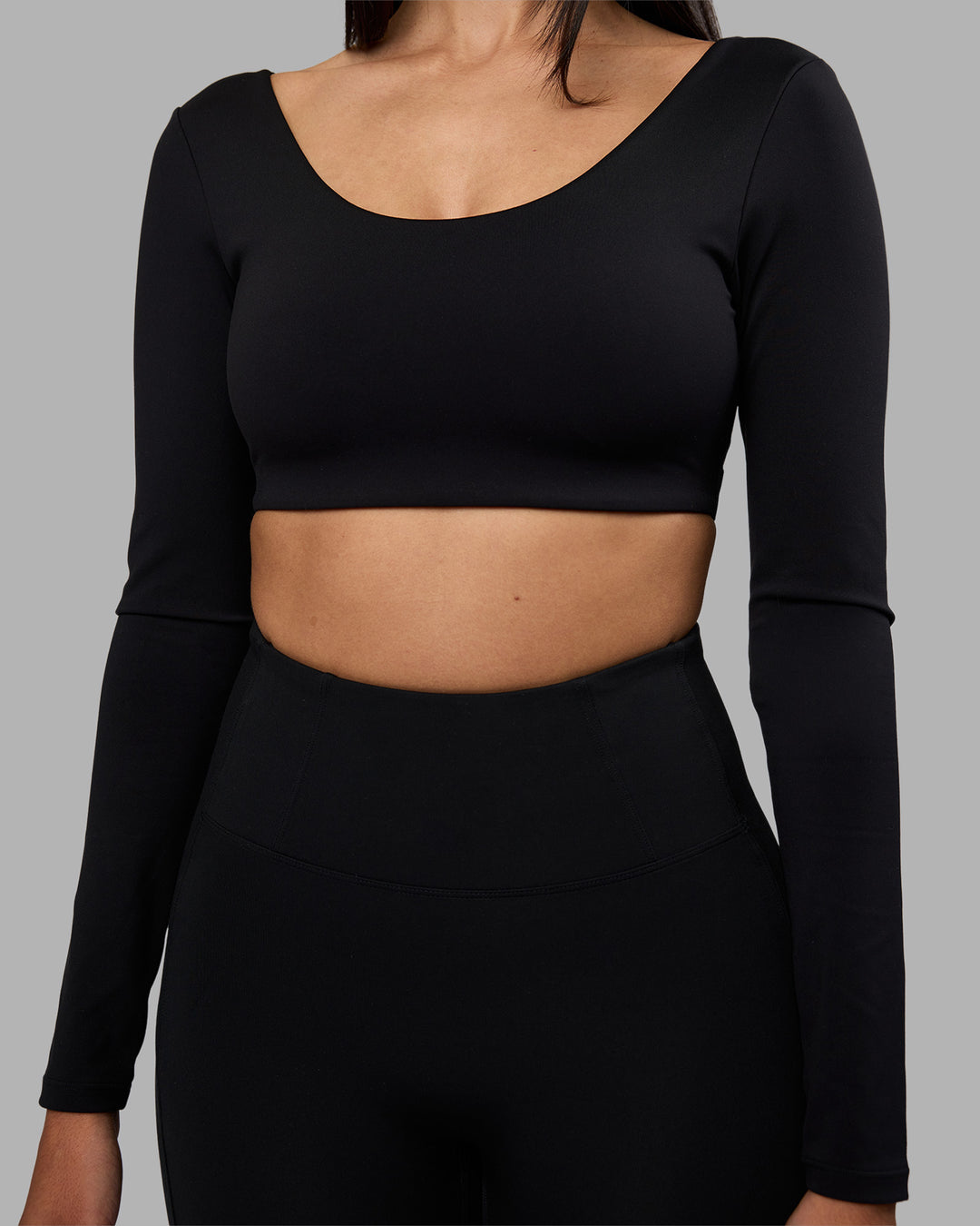 Woman wearing Aria Long Sleeve Sports Bra - Black | Model:Rhiley | Size:S - view 4