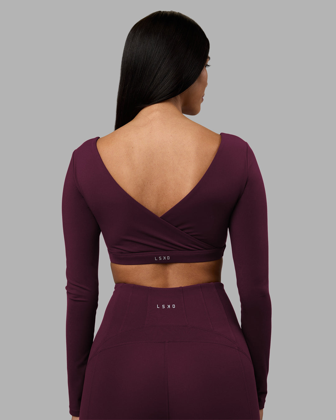 Woman wearing Aria Long Sleeve Sports Bra - Cherry Lacquer | Model:Rhiley | Size:S - view 5