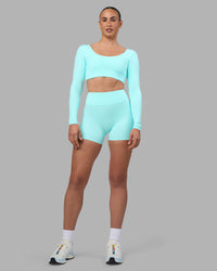 Woman wearing Aria Long Sleeve Sports Bra - Island Paradise | Model:Sophie | Size:S | Thumbnail Index: 7