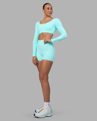 Woman wearing Aria Long Sleeve Sports Bra - Island Paradise | Model:Sophie | Size:S | Thumbnail Index: 6