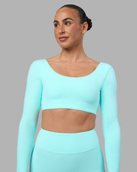 Woman wearing Aria Long Sleeve Sports Bra - Island Paradise | Model:Sophie | Size:S | Thumbnail Index: 3
