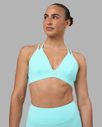 Woman wearing Aria Triangle Sports Bra - Island Paradise | Model:Sophie | Size:S | Thumbnail Index: 1