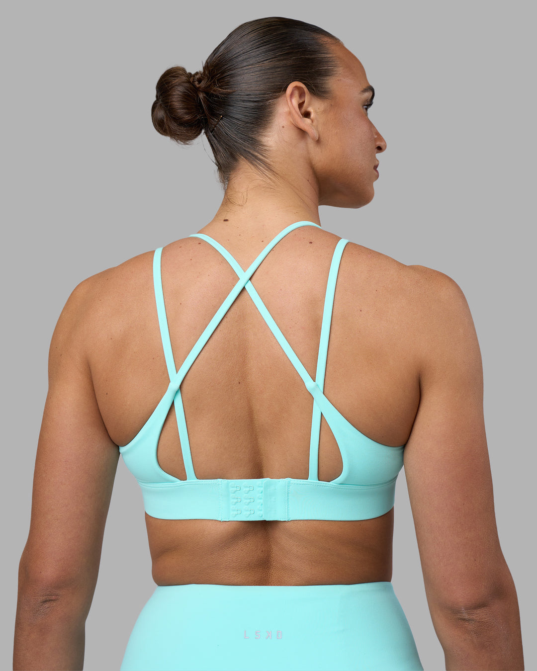 Woman wearing Aria Triangle Sports Bra - Island Paradise | Model:Sophie | Size:S - view 6