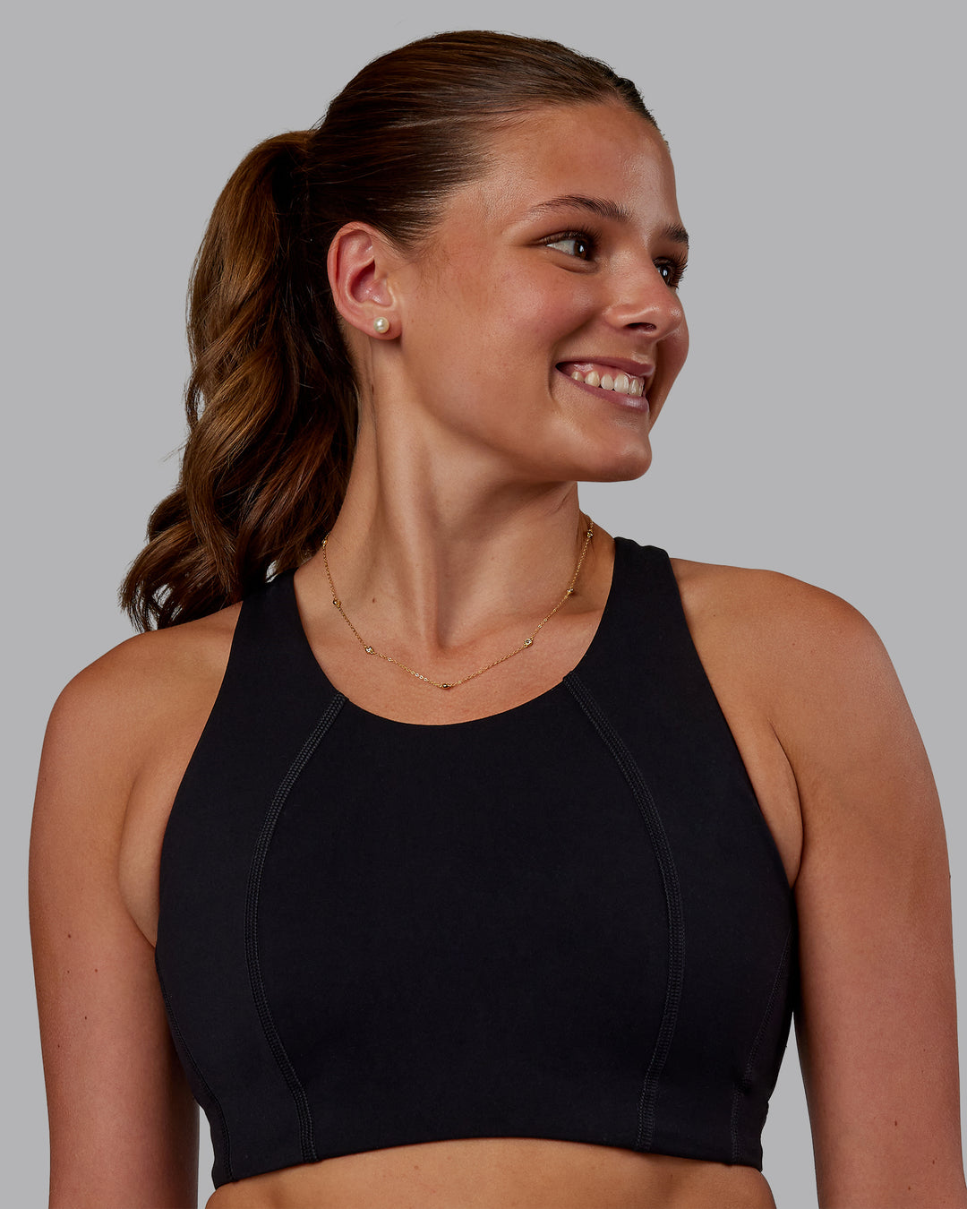 Woman wearing Ascent Sports Bra - Black | Model:Phoebe | Size:S - view 1