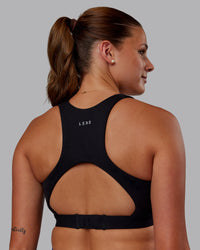 Woman wearing Ascent Sports Bra - Black | Model:Phoebe | Size:S | Thumbnail Index: 4