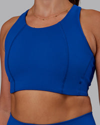 Woman wearing Ascent Sports Bra - Blue Quartz | Model:Phoebe | Size:S | Thumbnail Index: 4