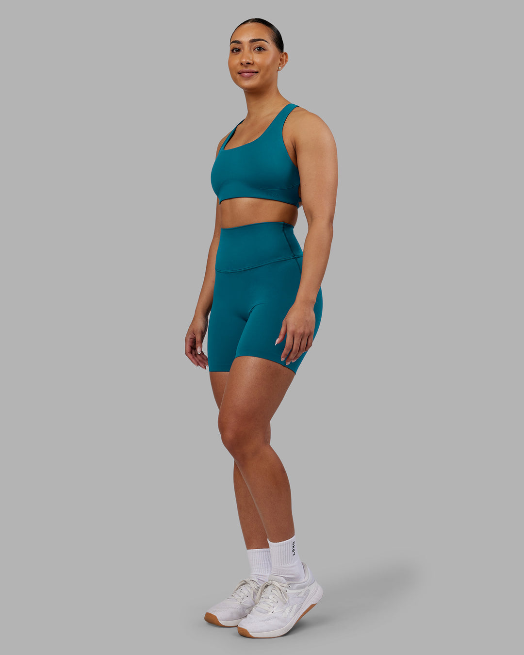 Woman wearing Aspire Sports Bra - Blue Coral | Model:Ayla | Size:S - view 3