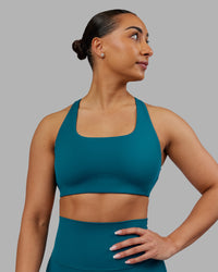 Woman wearing Aspire Sports Bra - Blue Coral | Model:Ayla | Size:S | Thumbnail Index: 0
