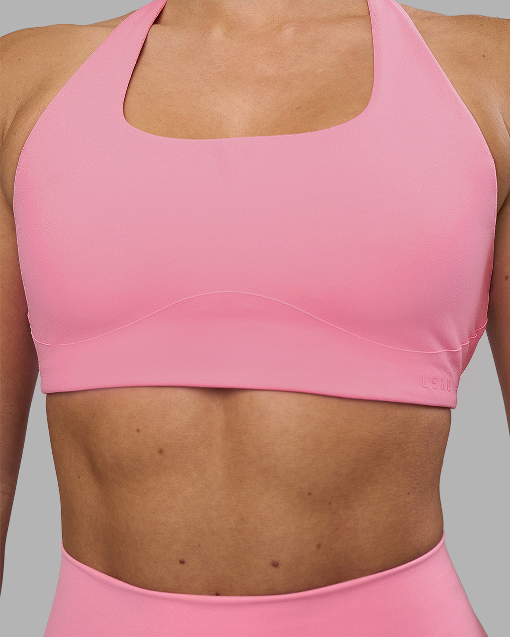 Woman wearing Aspire Sports Bra - Candy Pink | Model:Hannah | Size:S - view 2