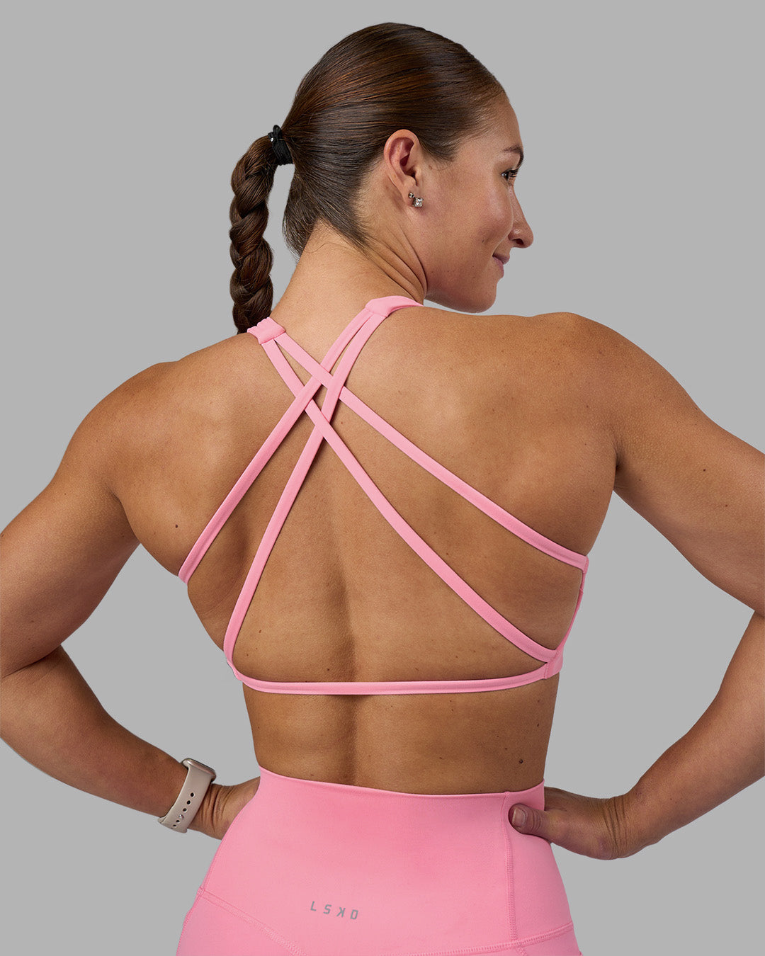 Woman wearing Aspire Sports Bra - Candy Pink | Model:Hannah | Size:S - view 1