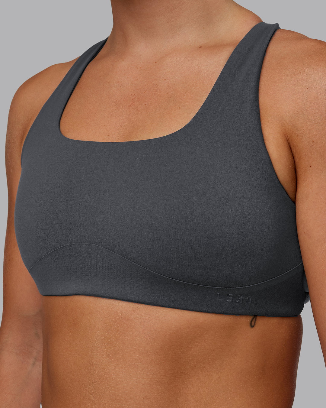 Woman wearing Aspire Sports Bra in Dark Storm | Size:S - view 5