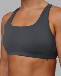 Woman wearing Aspire Sports Bra in Dark Storm | Size:S | Thumbnail Index: 4