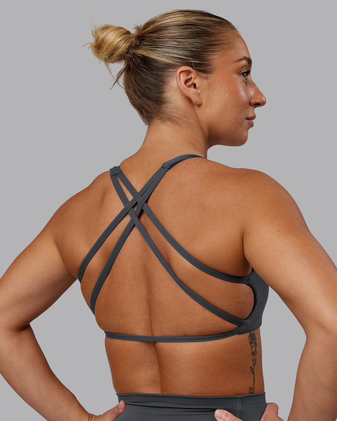 Woman wearing Aspire Sports Bra in Dark Storm | Size:S - view 4