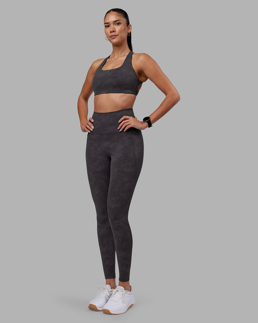 Woman wearing Aspire Sports Bra - Dark Storm Wash | Model:Rhiley | Size:S - view 3