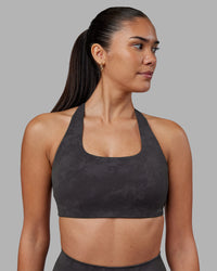 Woman wearing Aspire Sports Bra - Dark Storm Wash | Model:Rhiley | Size:S | Thumbnail Index: 0