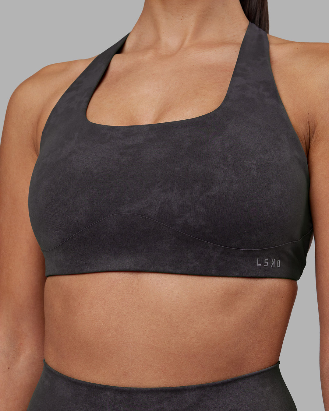 Woman wearing Aspire Sports Bra - Dark Storm Wash | Model:Rhiley | Size:S - view 5