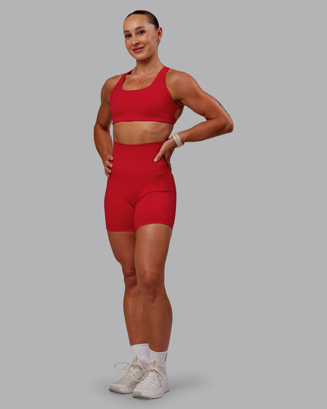 Woman wearing Aspire Sports Bra in Flame | Size:S - view 3