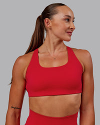Woman wearing Aspire Sports Bra in Flame | Size:S | Thumbnail Index: 1