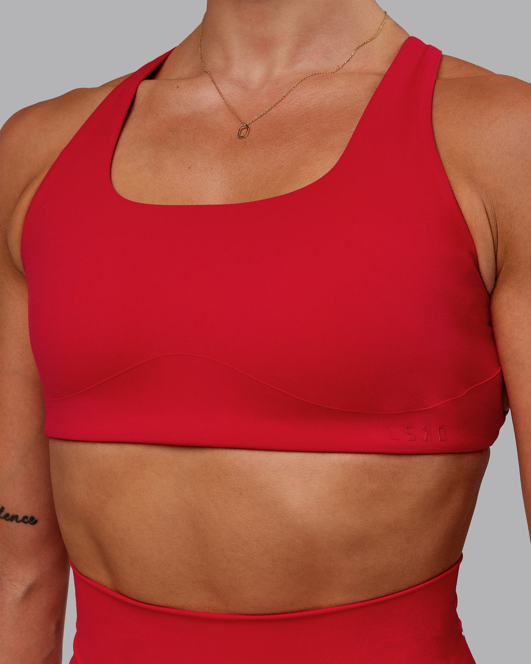 Woman wearing Aspire Sports Bra in Flame | Size:S - view 6