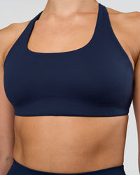 Woman wearing Aspire Sports Bra - Future Navy | Model:Evie | Size:S | Thumbnail Index: 4