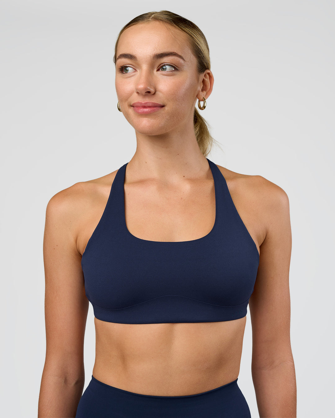 Woman wearing Aspire Sports Bra - Future Navy | Model:Evie | Size:S - view 2