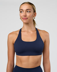 Woman wearing Aspire Sports Bra - Future Navy | Model:Evie | Size:S | Thumbnail Index: 1