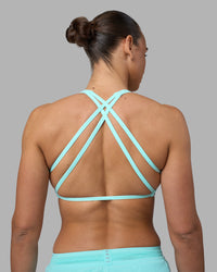 Woman wearing Aspire Sports Bra - Island Paradise | Model:Sophie | Size:S | Thumbnail Index: 1