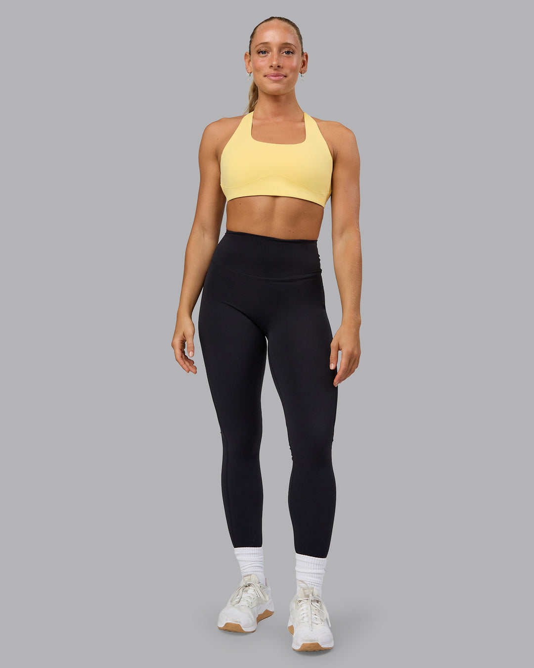 Woman wearing Aspire Sports Bra - Lemon - view 5